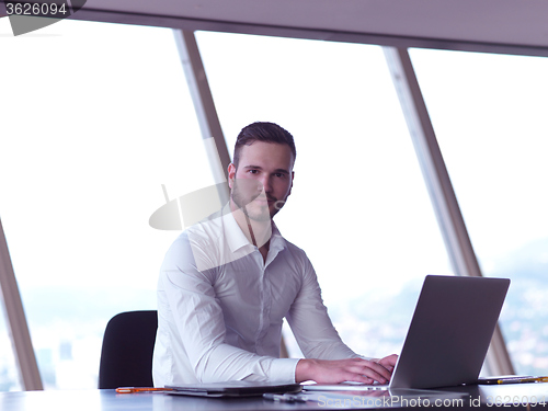 Image of young business man at office