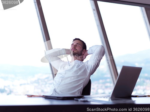 Image of young business man at office