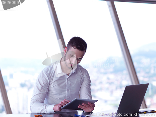 Image of young business man at office