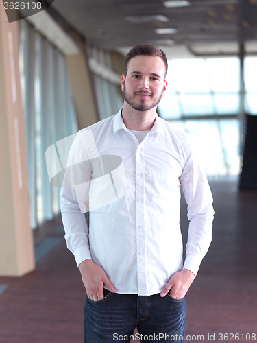 Image of portrait of young  business man with beard at modern office