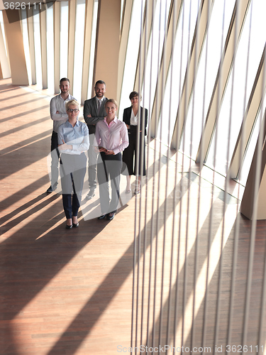 Image of business people group standing together
