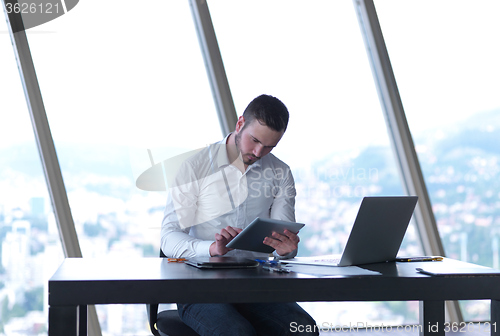 Image of young business man at office