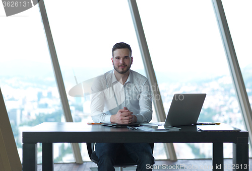 Image of young business man at office