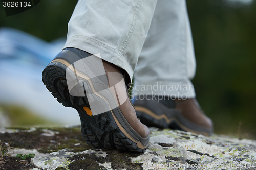 Image of hiking man with trekking boots