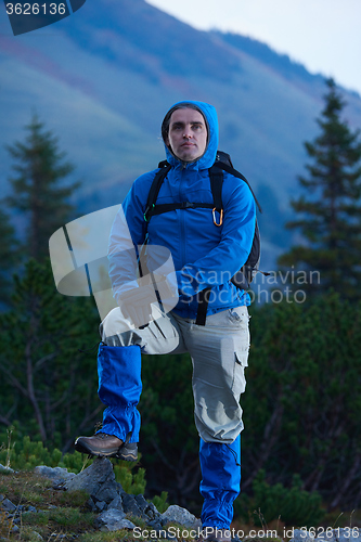 Image of advanture man with backpack hiking