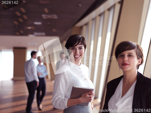 Image of business people group standing together