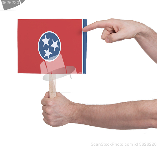 Image of Hand holding small card - Flag of Tennessee