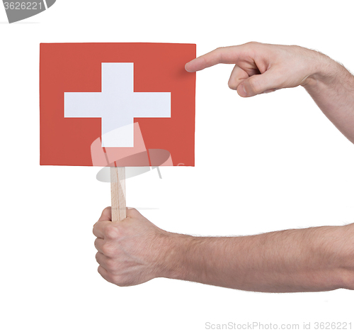 Image of Hand holding small card - Flag of Switzerland