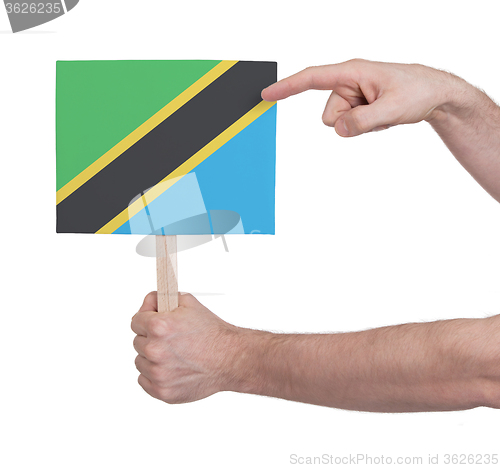 Image of Hand holding small card - Flag of Tanzania