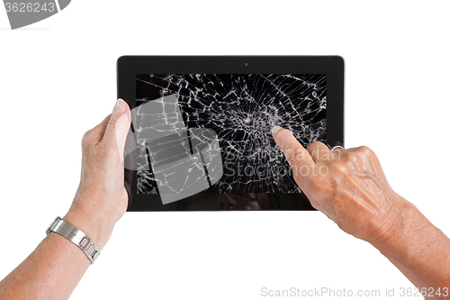 Image of Senior lady with tablet, cracked screen