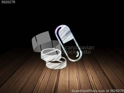Image of Healthcare concept: Pills in grunge dark room
