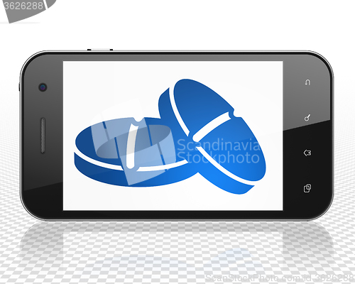 Image of Health concept: Smartphone with Pills on display