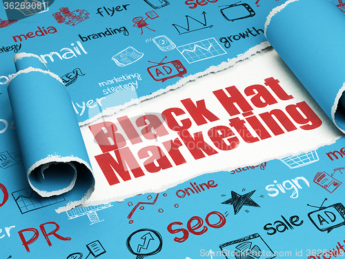 Image of Advertising concept: red text Black Hat Marketing under the piece of  torn paper