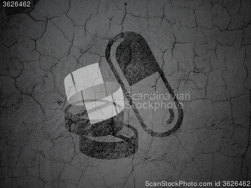 Image of Medicine concept: Pills on grunge wall background