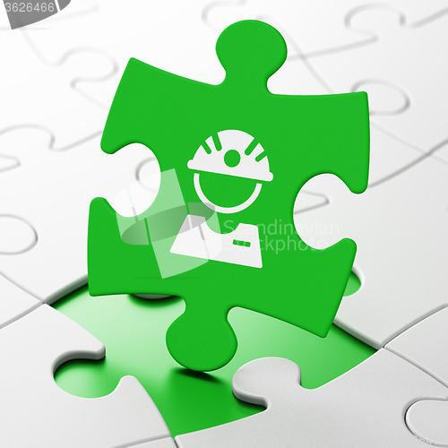 Image of Manufacuring concept: Factory Worker on puzzle background