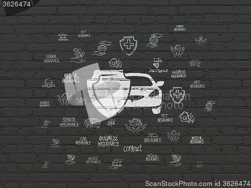 Image of Insurance concept: Car And Shield on wall background