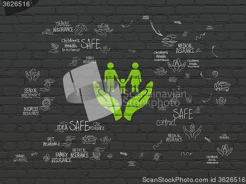 Image of Insurance concept: Family And Palm on wall background