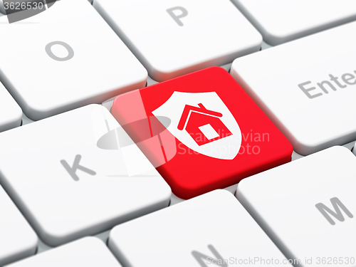 Image of Finance concept: Shield on computer keyboard background