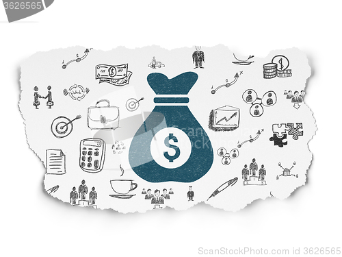 Image of Finance concept: Money Bag on Torn Paper background