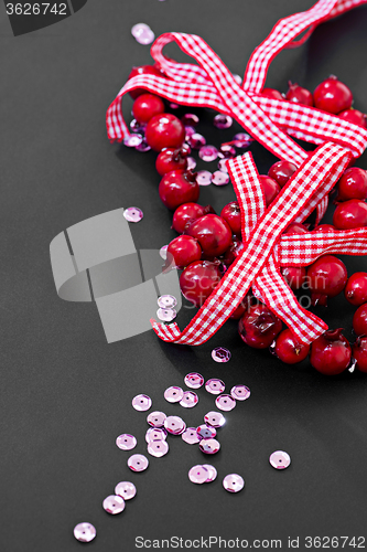 Image of Christmas decoration and pink sequins