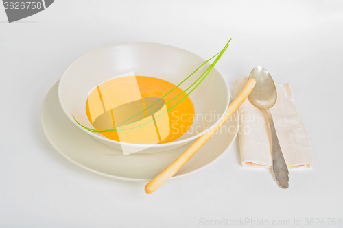 Image of Pumpkin cream soup with spoon