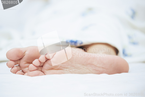 Image of Feet of sleeping woman