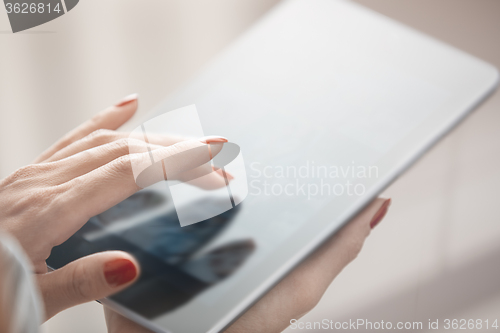 Image of Woman with tablet computer