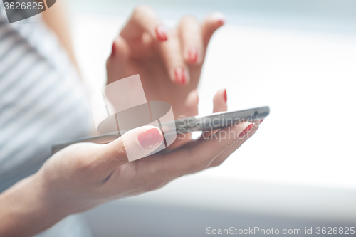 Image of Woman using smartphone