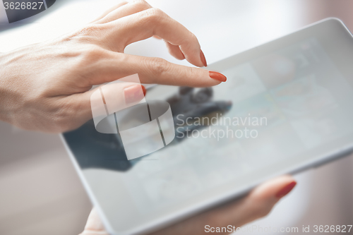 Image of Woman with tablet computer