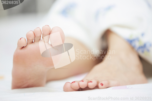 Image of Feet of sleeping woman