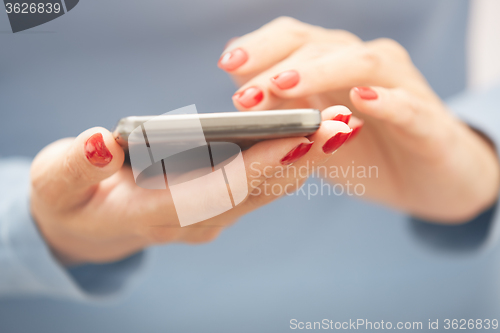 Image of Woman using smartphone