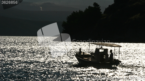 Image of Fishing boats silhouette in the  Peloponese in Greece