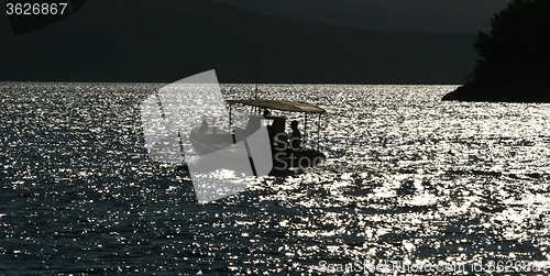 Image of Fishing boats silhouette in the  Peloponese in Greece