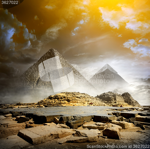 Image of Storm clouds and pyramids