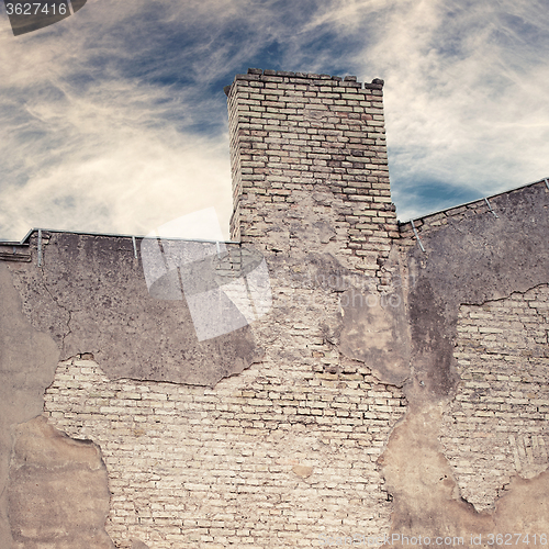 Image of abandoned grunge cracked brick stucco wall