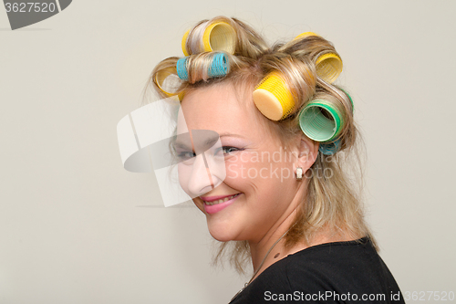 Image of Woman with curler