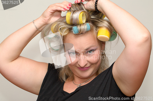 Image of Woman with curler