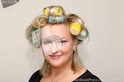 Image of Woman with curler