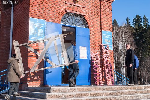 Image of Workers make out church to Easter. Zavodoukovsk