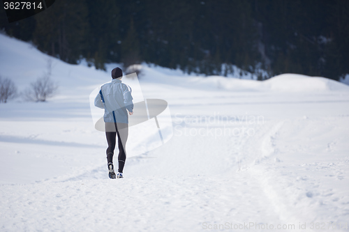 Image of jogging on snow in forest