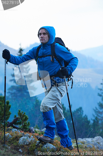 Image of advanture man with backpack hiking