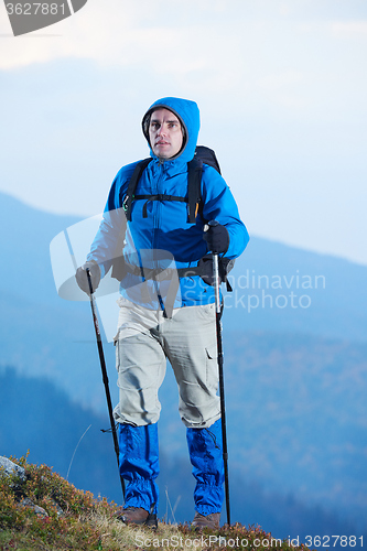 Image of advanture man with backpack hiking