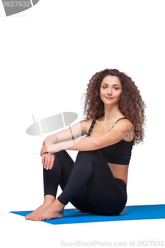 Image of Studio shot of a young fit woman after yoga exercises.