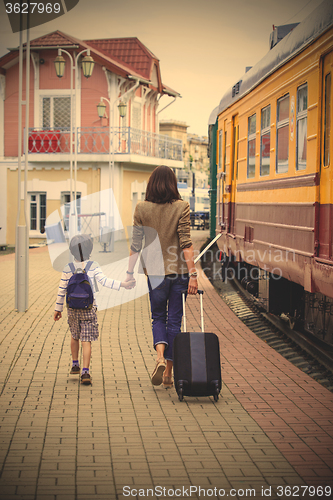 Image of Mother and son goes on the landside platform