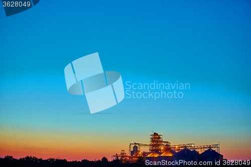 Image of Agricultural Silo - Building Exterior, Storage and drying of grains, wheat, corn, soy, sunflower against sunset. 
