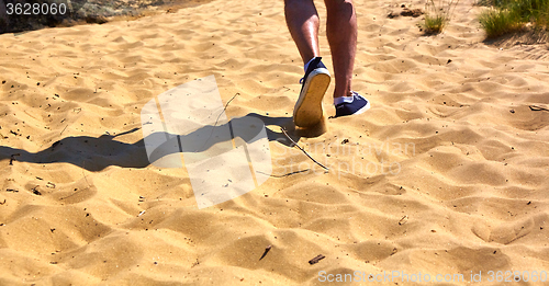 Image of Close up fashion image of man walking alone 