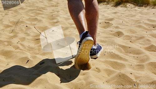 Image of Close up fashion image of man walking alone 