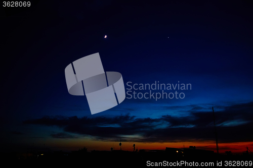 Image of Silhouettes of houses in the sunset