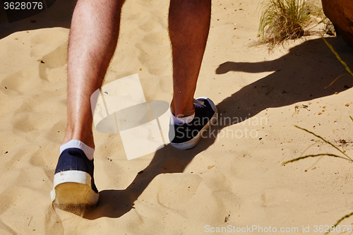 Image of Close up fashion image of man walking alone