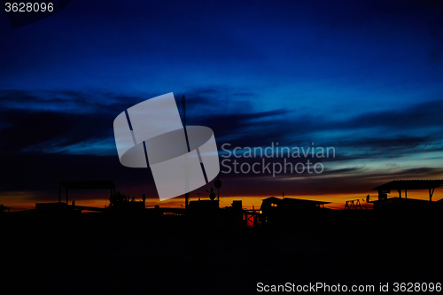 Image of Silhouettes of houses in the sunset